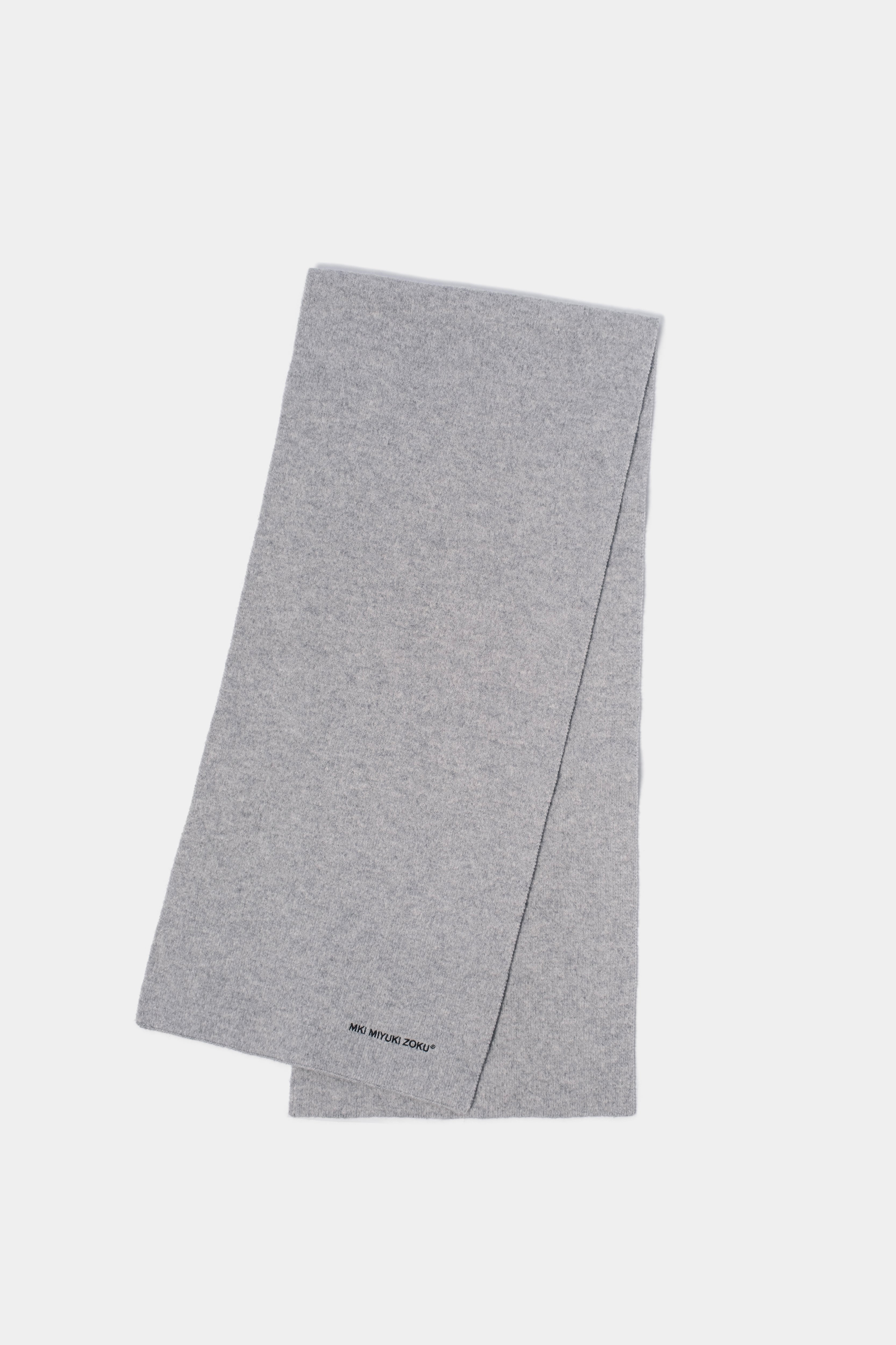 Full-length flat lay of the Ash double knit scarf folded lengthways