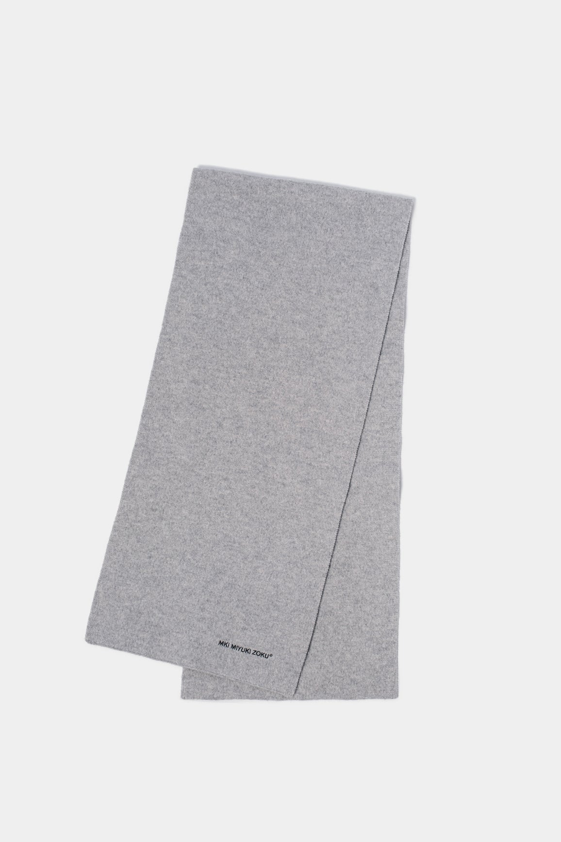 Full-length flat lay of the Ash double knit scarf folded lengthways