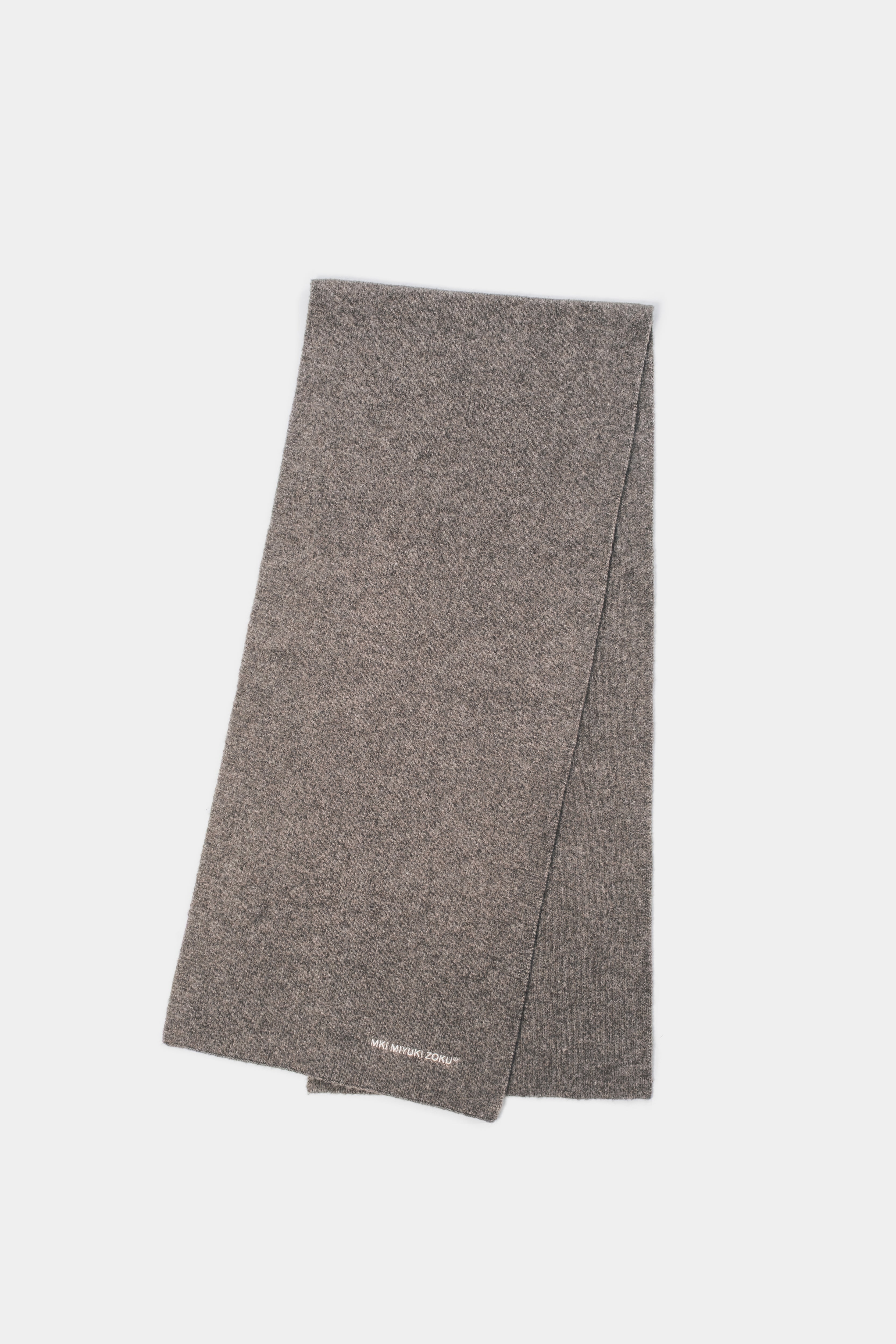 Full-length flat lay of the Brown double knit scarf folded lengthways
