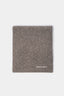Folded flat lay of the Brown double knit scarf showing the white logo embroidery at the corner
