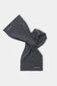 MKI MIYUKI ZOKU Double Knit Scarf in Charcoal – knotted flat lay showing the compact double knit and embroidered logo at each end