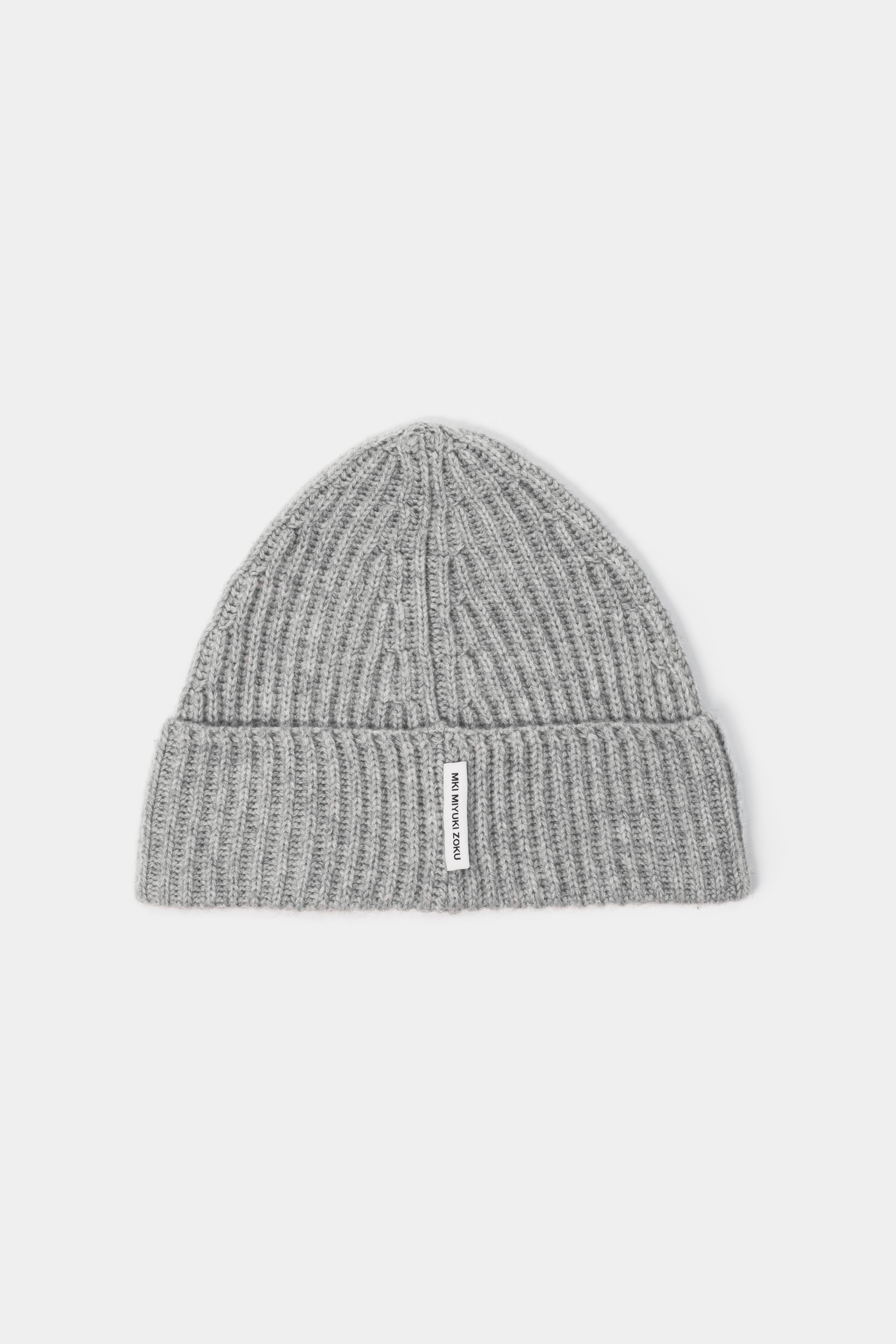 MKI MIYUKI ZOKU Cashmere Ribbed Beanie in Light Grey – front view showing the heavy gauge rib, single turn-up and woven MKI MIYUKI ZOKU tag