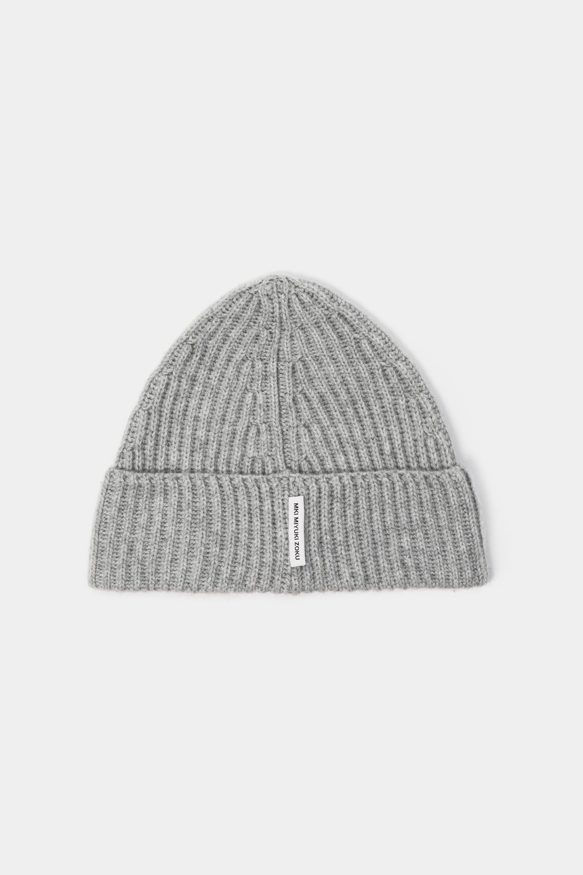 MKI MIYUKI ZOKU Cashmere Ribbed Beanie in Light Grey – front view showing the heavy gauge rib, single turn-up and woven MKI MIYUKI ZOKU tag