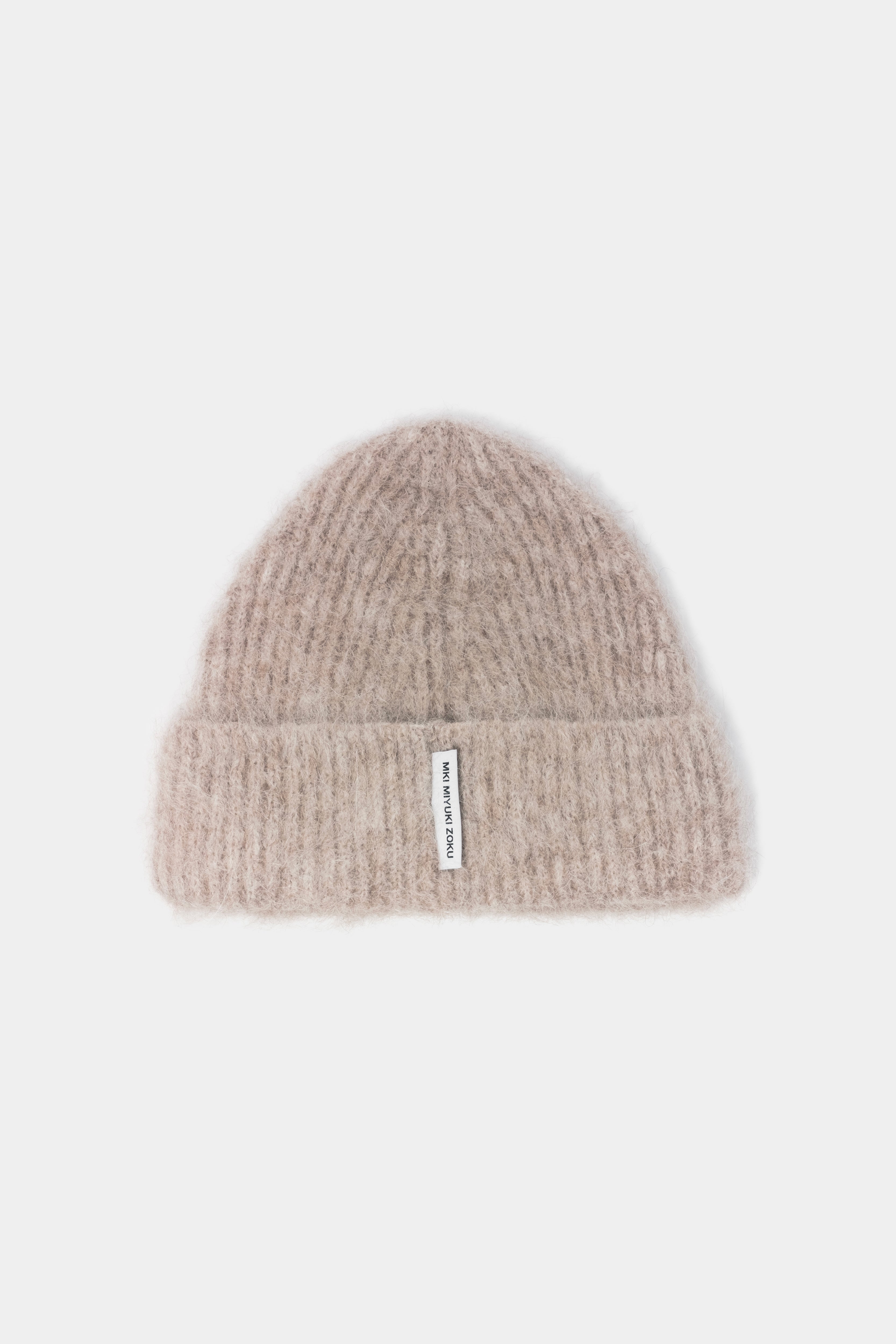 MKI MIYUKI ZOKU Alpaca Beanie in Oatmeal – front view showing the fuzzy brushed alpaca knit, single turn-up and woven MKI MIYUKI ZOKU tag