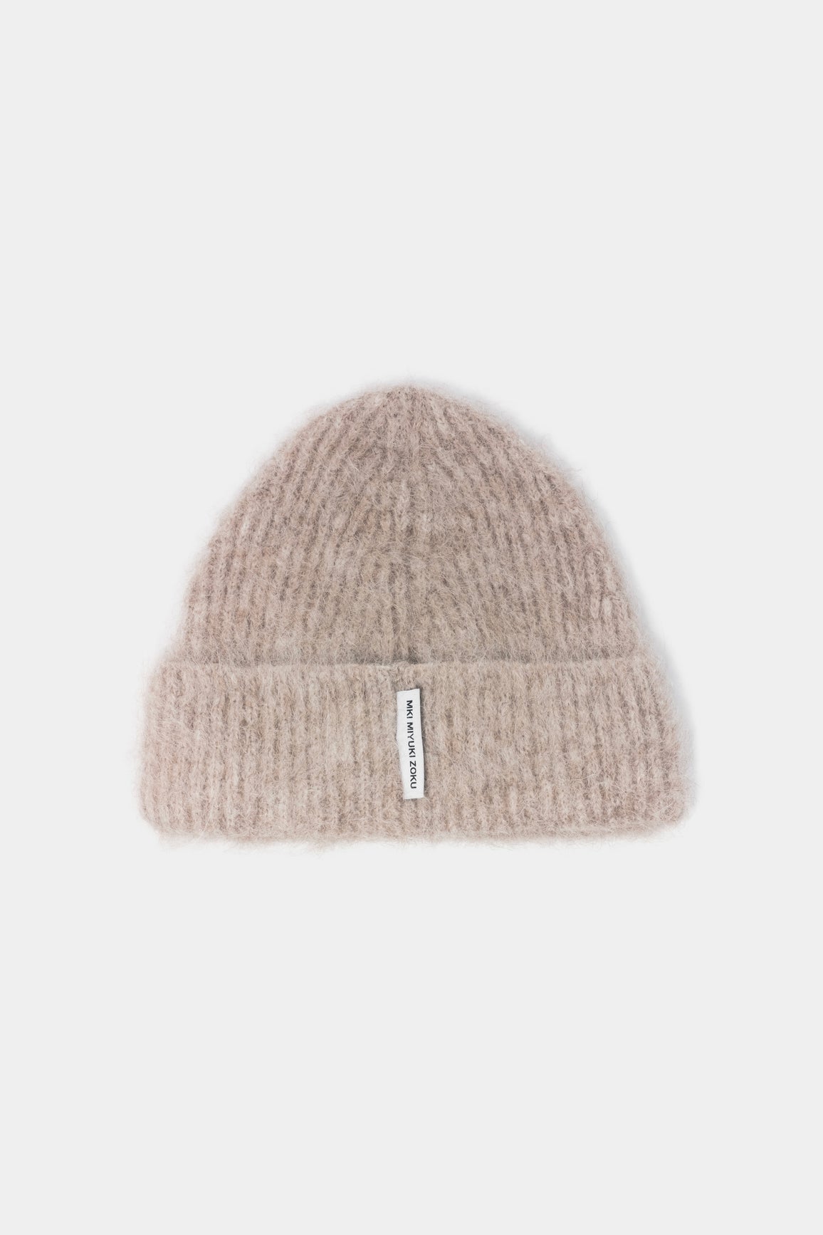 MKI MIYUKI ZOKU Alpaca Beanie in Oatmeal – front view showing the fuzzy brushed alpaca knit, single turn-up and woven MKI MIYUKI ZOKU tag