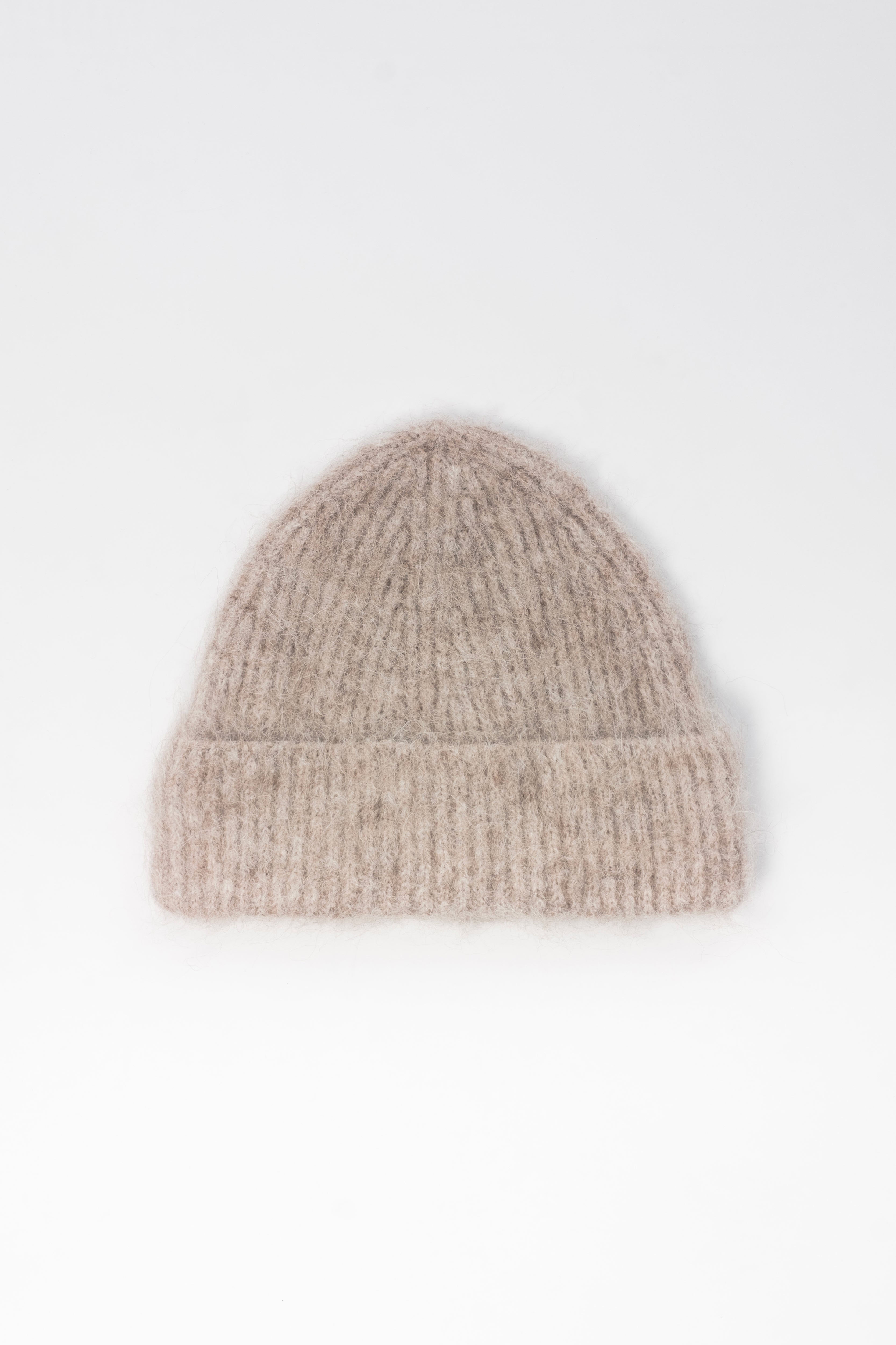 Reverse view of the Oatmeal alpaca beanie showing the soft, hairy texture and turn-up