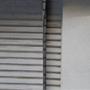 Grey metal roller shutter door with horizontal slats