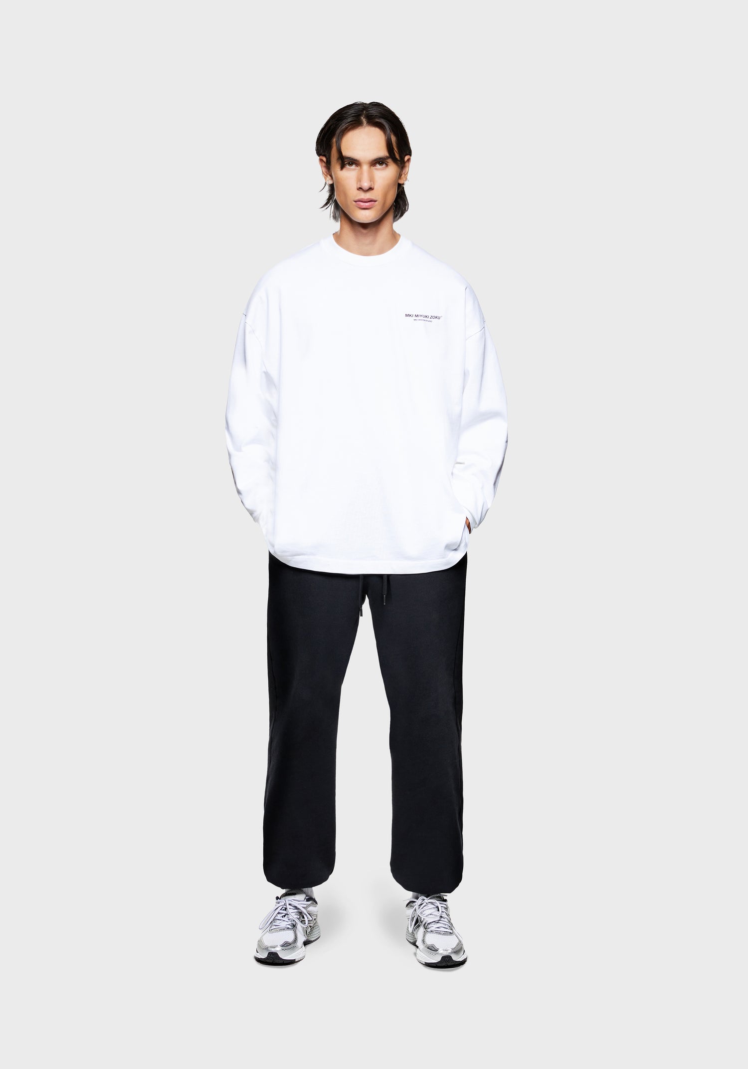 Full front view of the MKI Design Studio long sleeve oversized t-shirt in a white colourway in a boxy fit