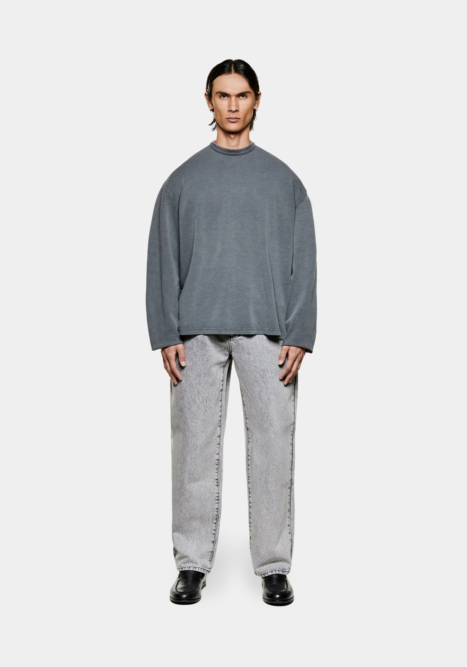 Full view of the men's boxy MKI 220gsm cotton slub jersey long sleeve t-shirt in pigment-washed black