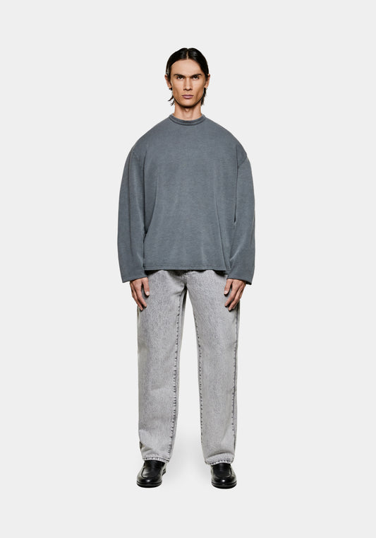 Full view of the men's boxy MKI 220gsm cotton slub jersey long sleeve t-shirt in pigment-washed black