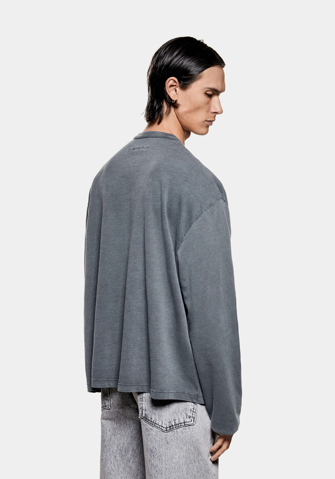 Back view of the Pigment Black slub long sleeve T-shirt on the model, showing the relaxed box fit