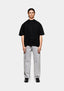 MKI MIYUKI ZOKU 220 GSM Slub T-Shirt in Black – full-length front view on the model, worn with light wash straight-leg jeans