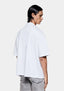 Back view of the white slub T-shirt on the model, showing the relaxed box fit
