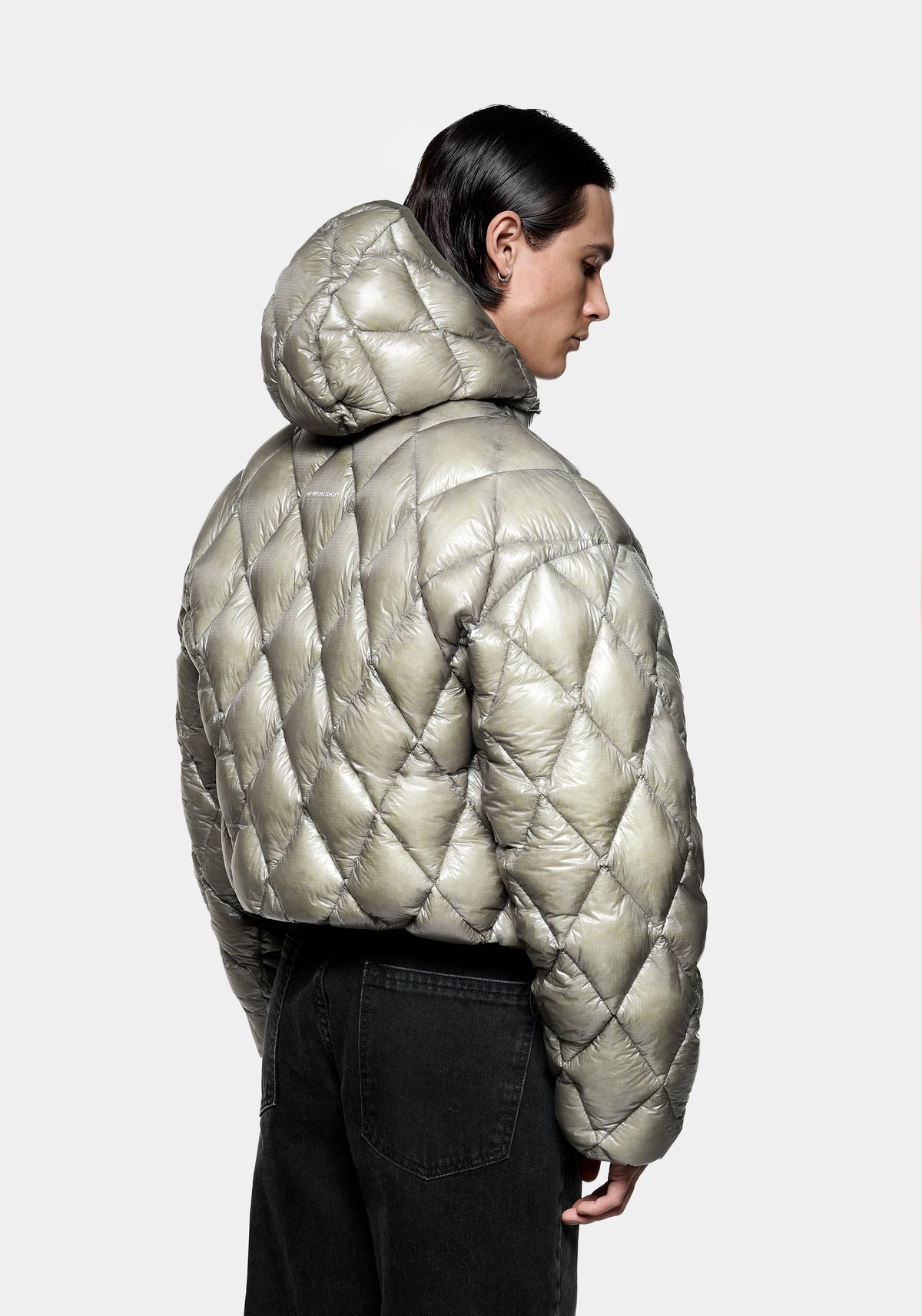 Front view with the hood up on the Diamond Down Jacket in Sage