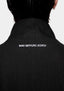 Close-up of the MKI MIYUKI ZOKU logo embroidered at the back neck