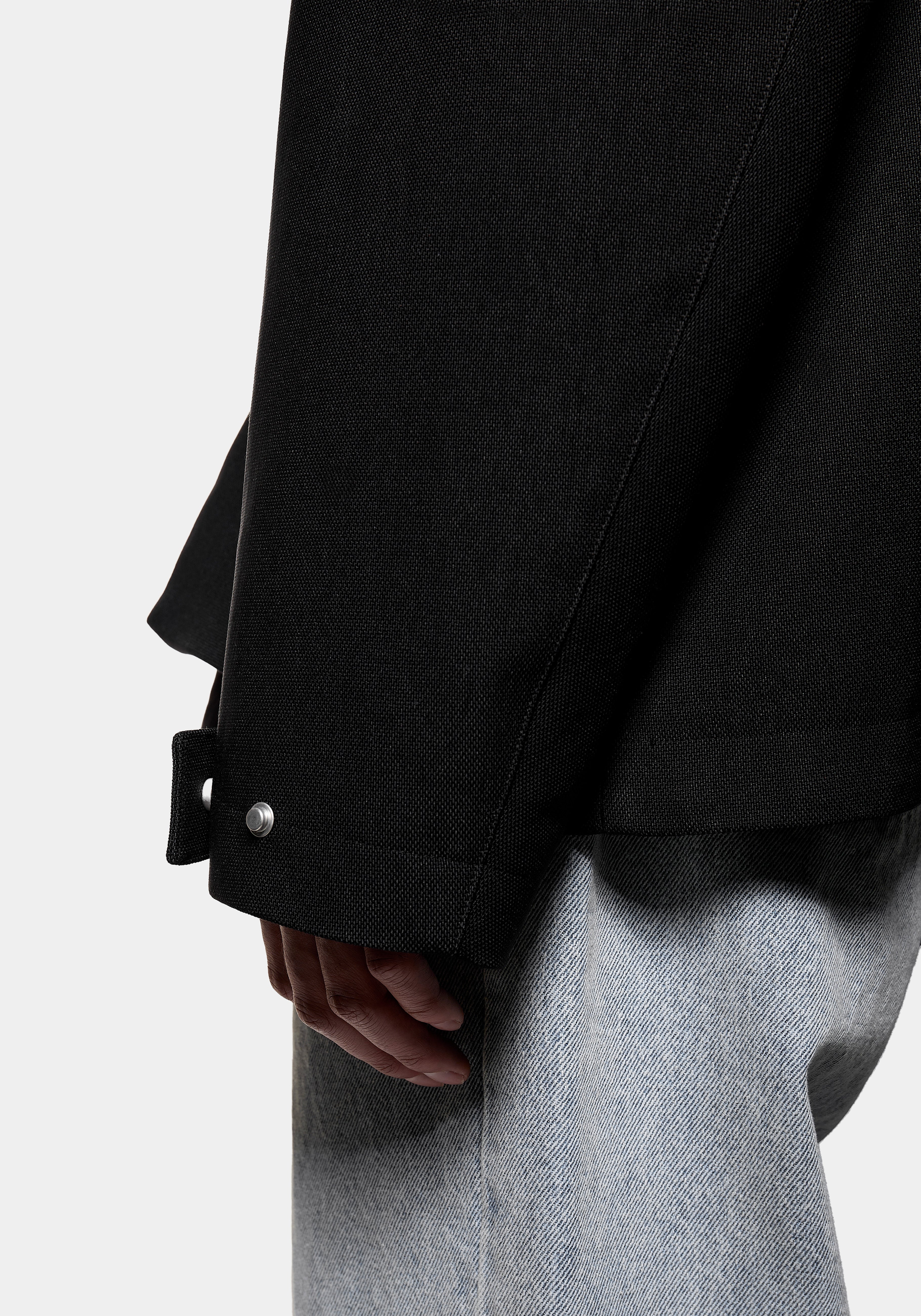 Close-up of the sleeve cuff with press stud
