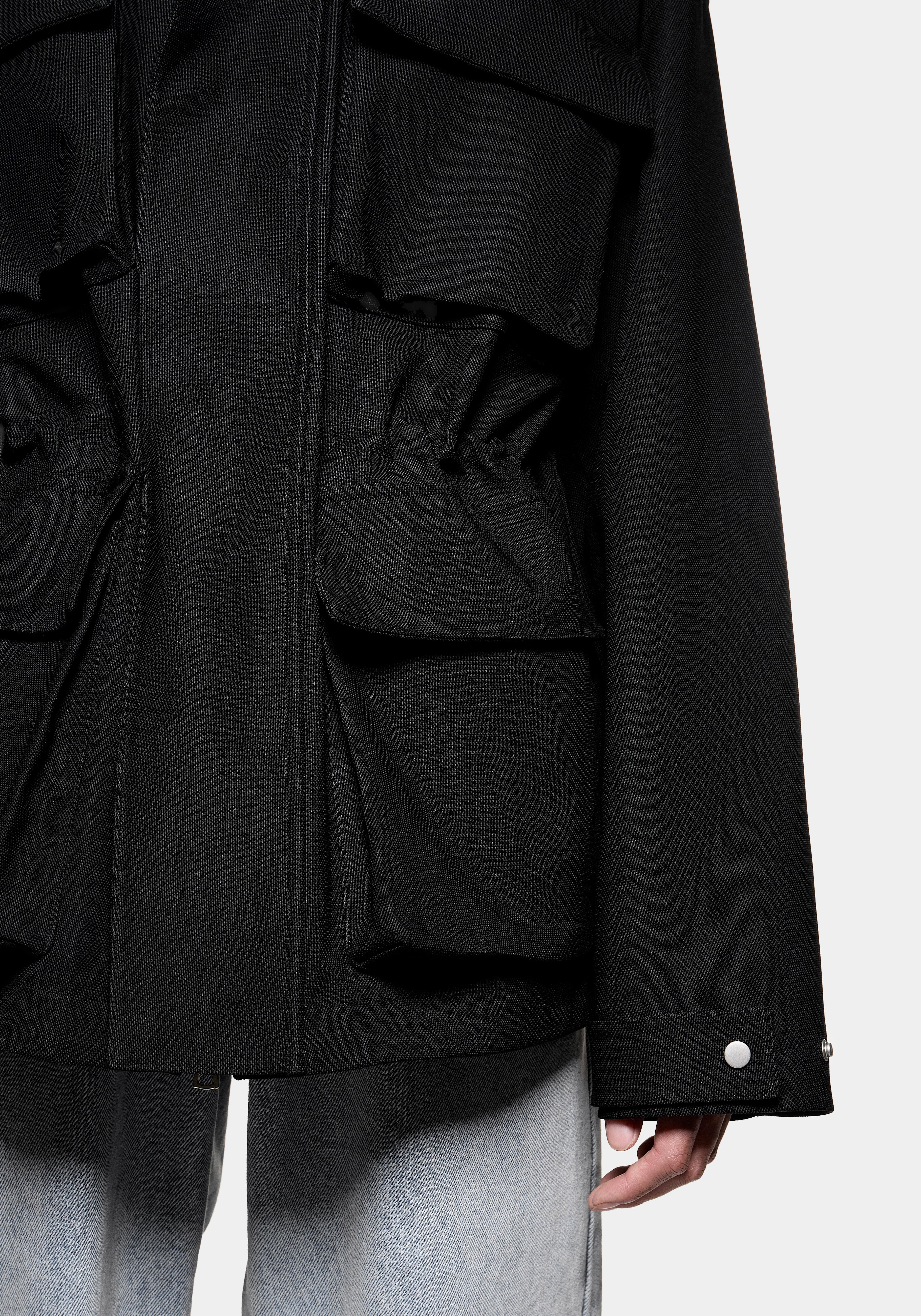 Close-up of the 3D flap pockets and elastic waist adjustment