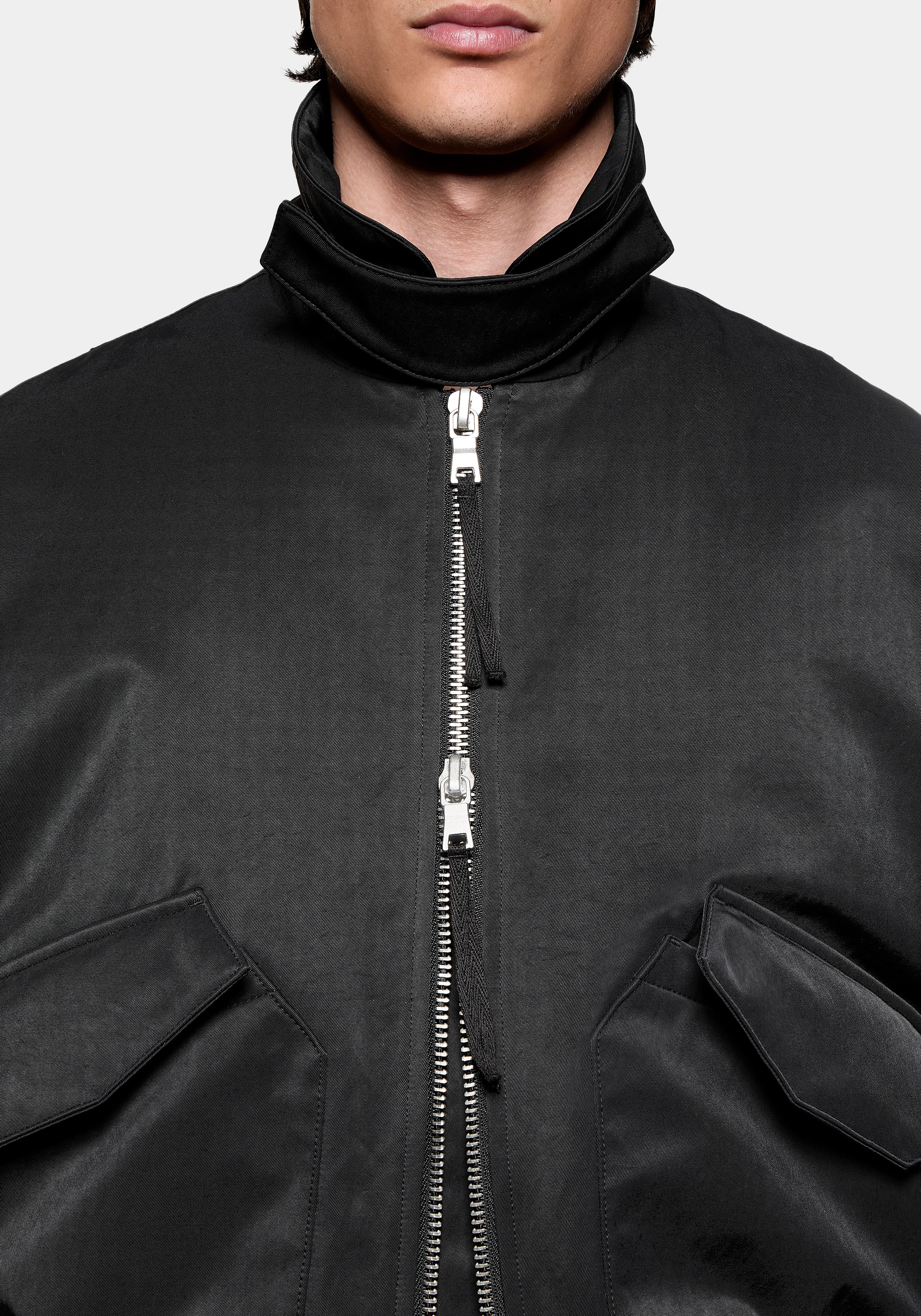 Close-up of the high collar and two-way zip