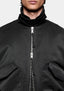 Close-up of the high collar and two-way zip