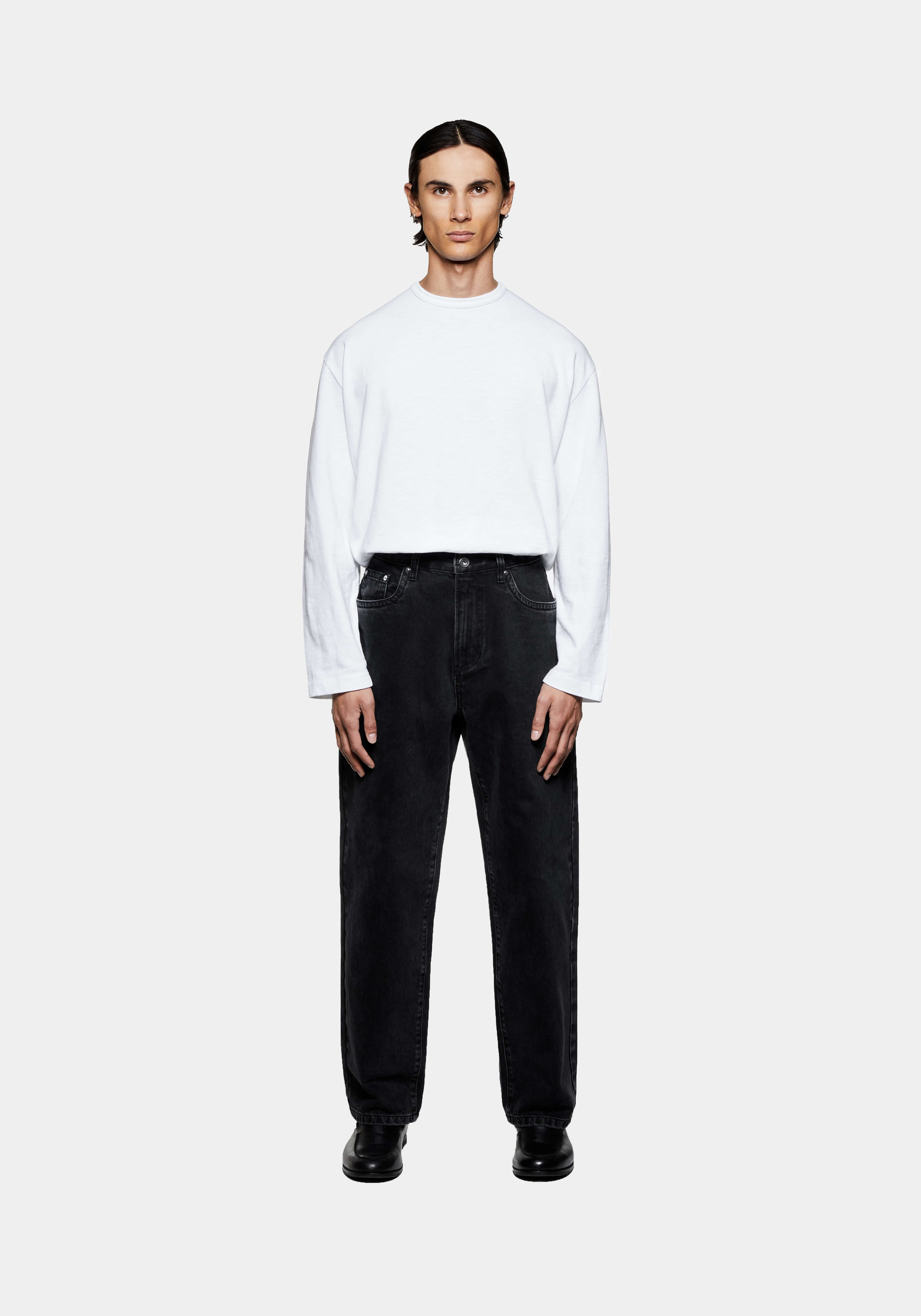 MKI MIYUKI ZOKU Denim Classic Jean in Black Wash – full-length front view on the model, worn with a white long sleeve T-shirt and black loafers