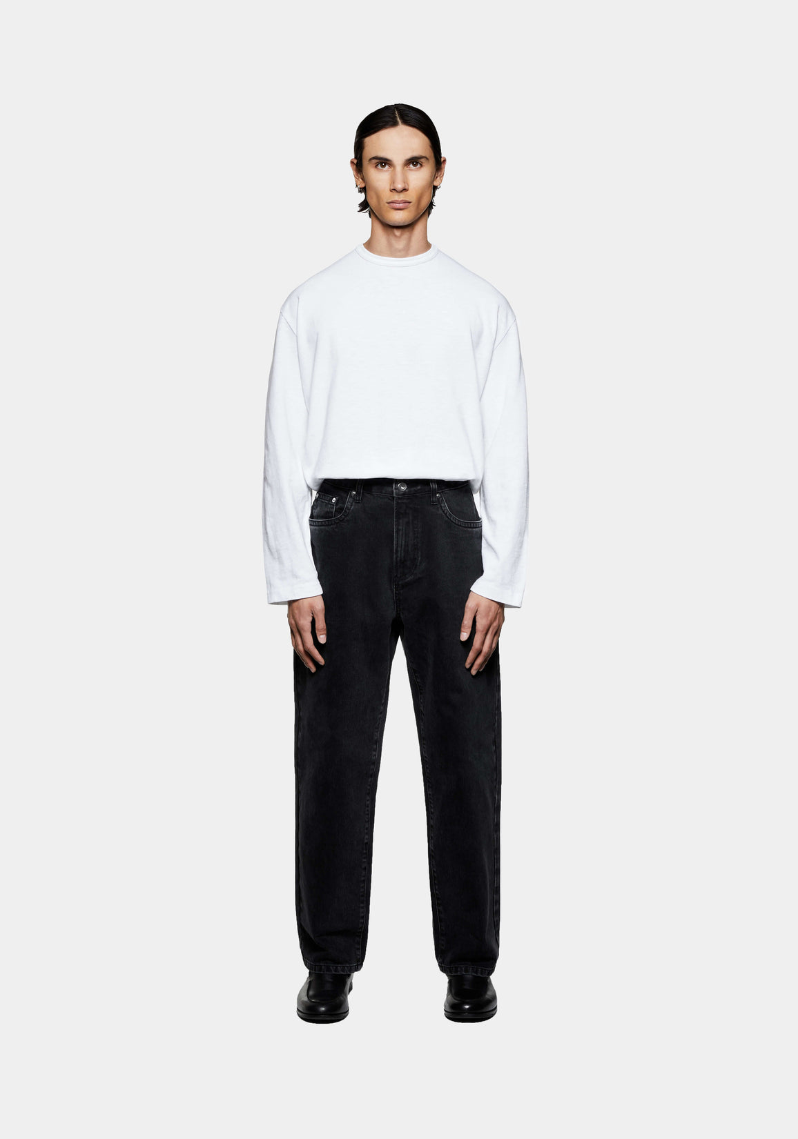MKI MIYUKI ZOKU Denim Classic Jean in Black Wash – full-length front view on the model, worn with a white long sleeve T-shirt and black loafers