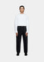MKI MIYUKI ZOKU Denim Classic Jean in Black Wash – full-length front view on the model, worn with a white long sleeve T-shirt and black loafers