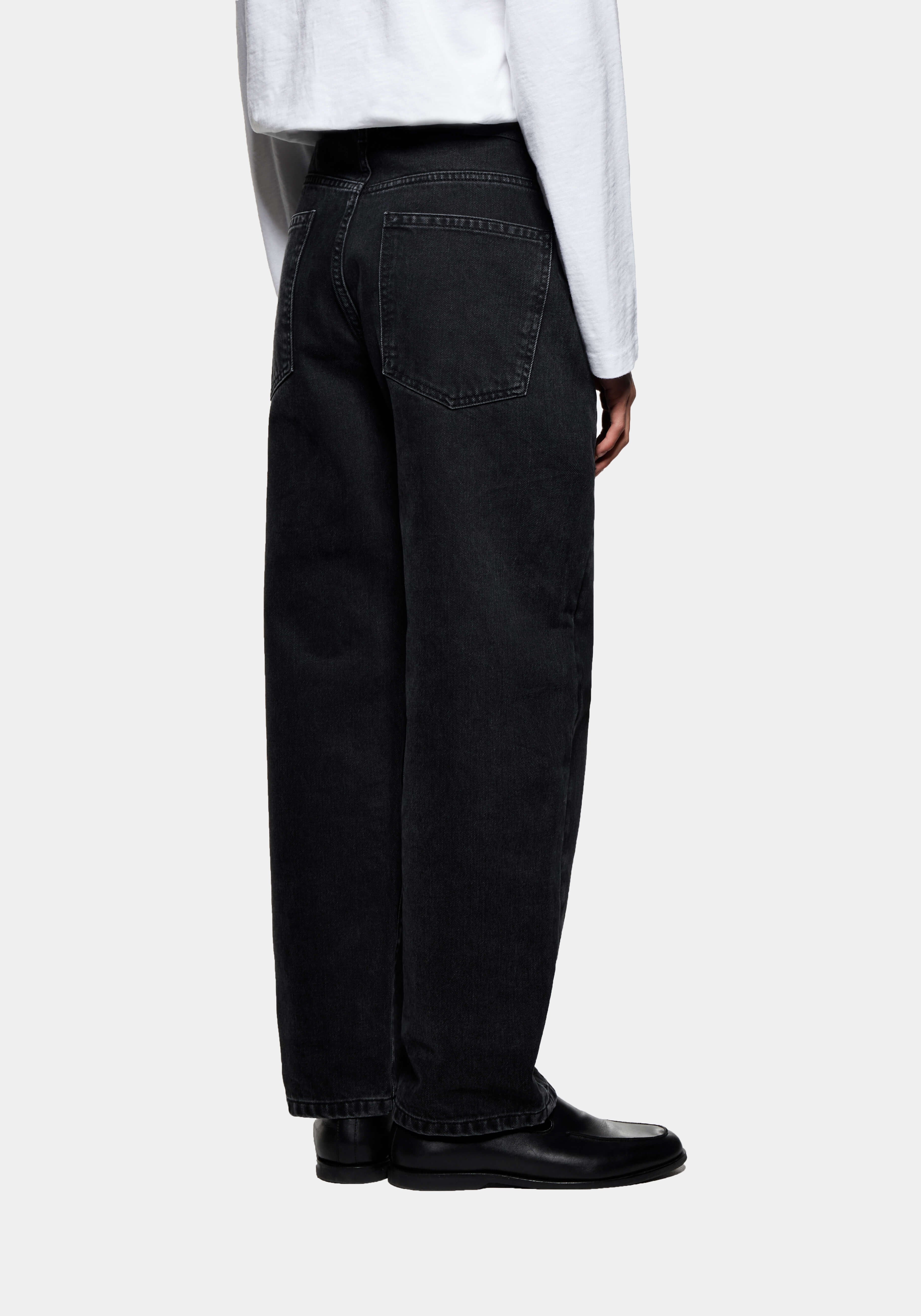 Back view of the Black Wash jeans showing the rear patch pockets and straight fit