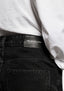 Close-up of the black leather MKI MIYUKI ZOKU patch at the back right waistband