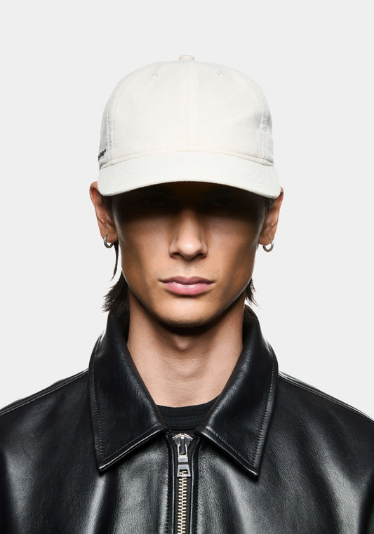MKI 6-Panel cap in off-white cotton with MKI Miyuki Zoku embroidery on the right hand side. 