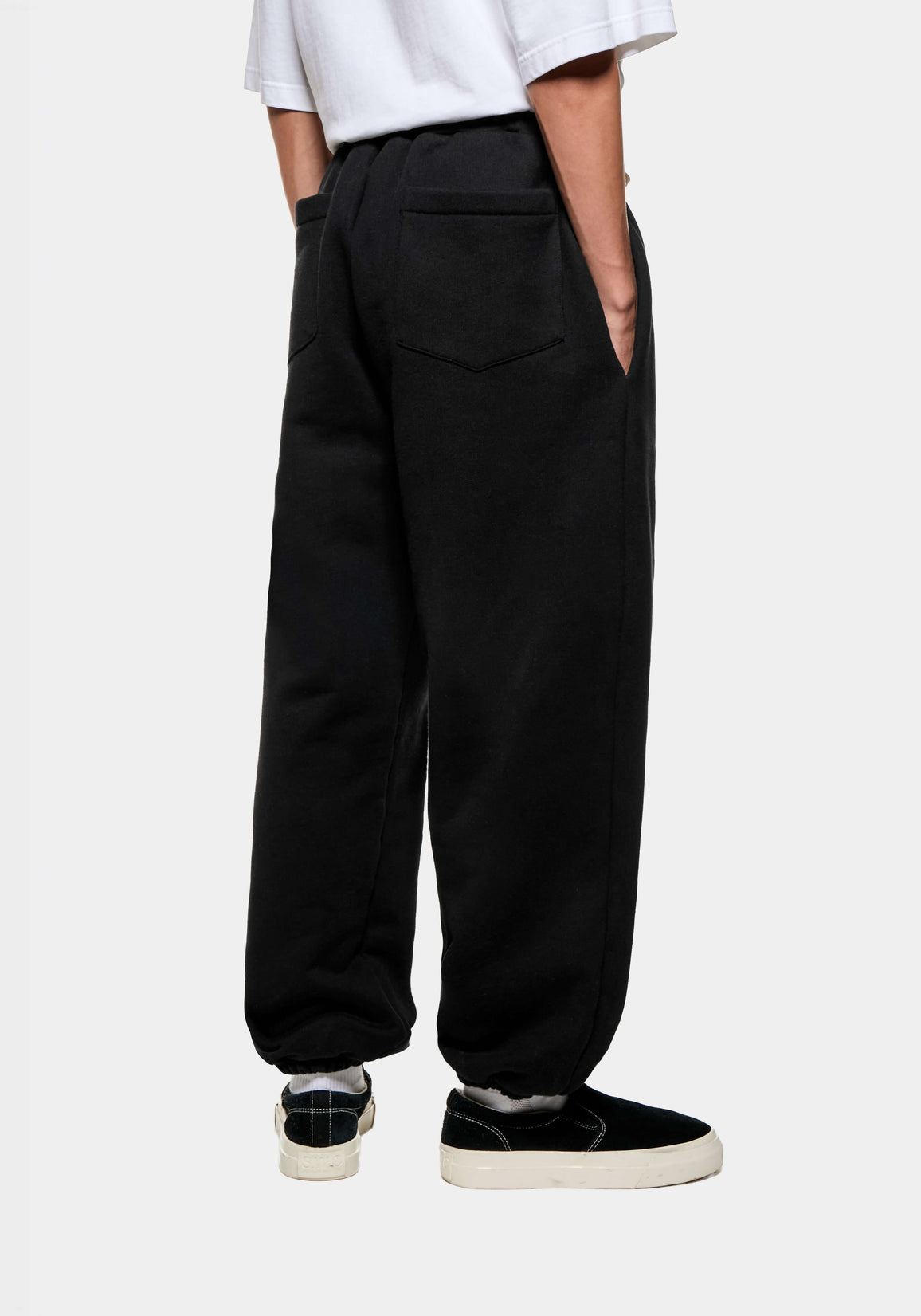 Back three-quarter view of the Black Superweight Joggers showing the rear patch pocket