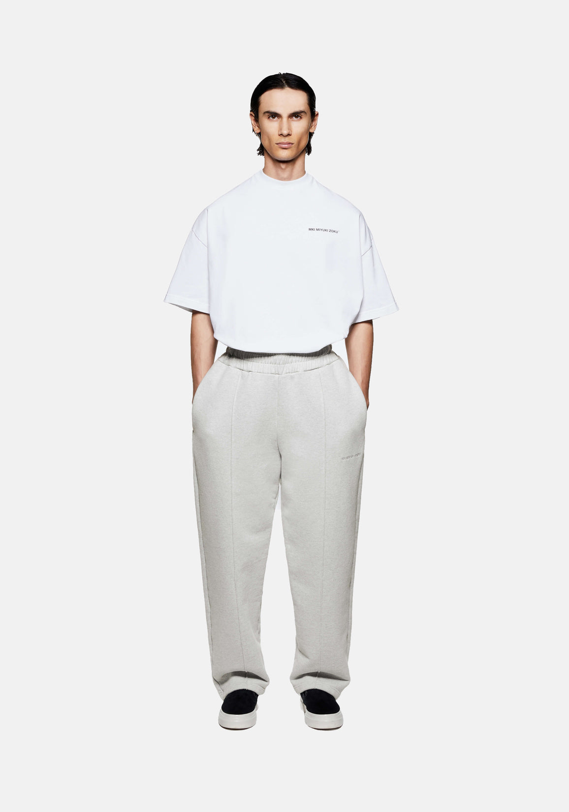MKI MIYUKI ZOKU 800 GSM Superweight Wide Leg Joggers in Oatmeal – full-length front view on the model showing the wide leg, front pleats and open hems