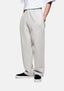 Front three-quarter view of the Oatmeal Wide Leg Joggers showing the sewn-in pleat and heavy drape