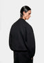 Back view of the black Superweight crewneck on the model, showing the boxy oversized shape