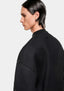 Close-up of the dropped shoulder seam on the black Superweight crewneck