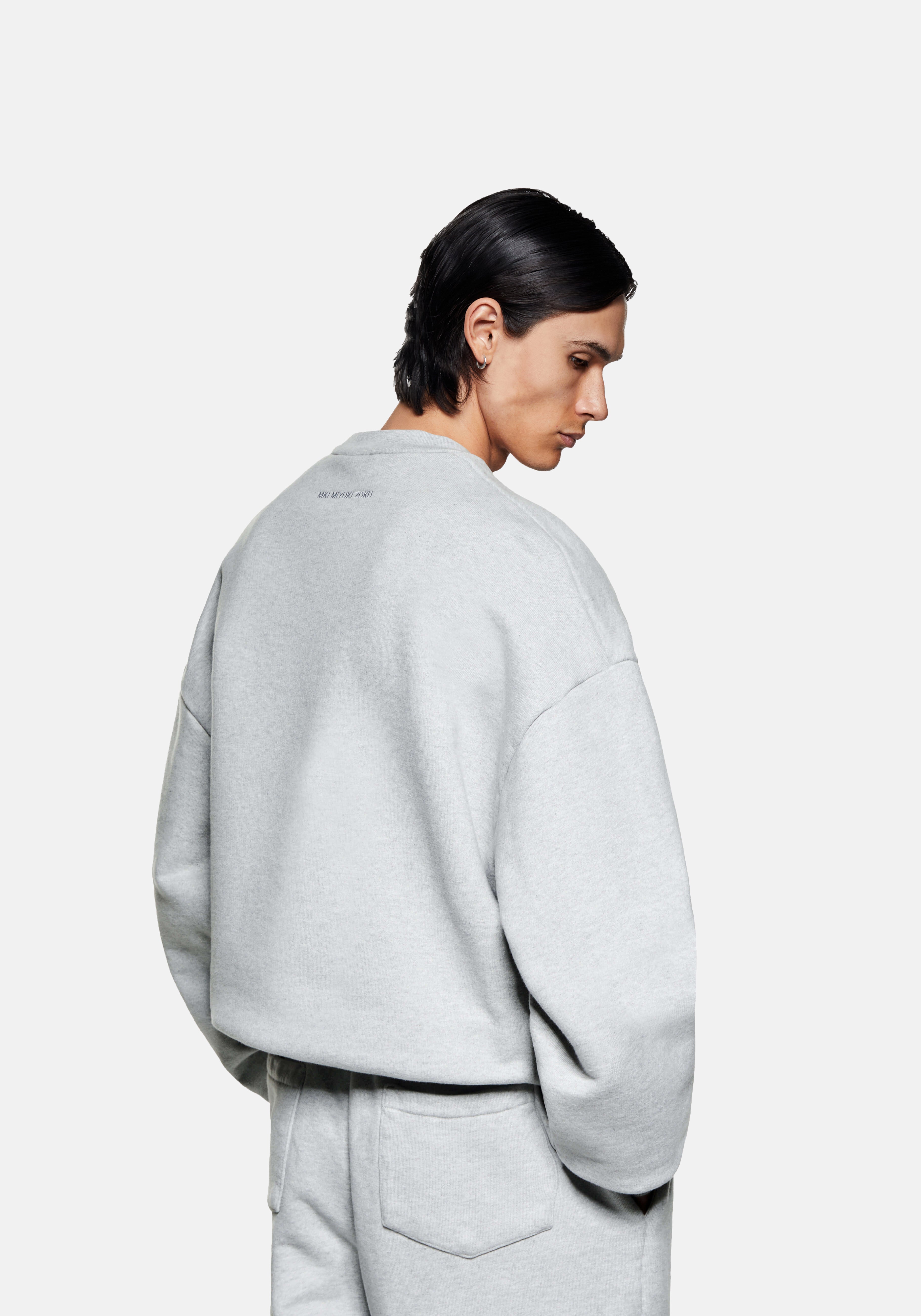 Rear side view of the Superweight Crewneck in Grey