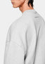 Close-up showing the dropped shoulders on the Superweight Crewneck in Grey