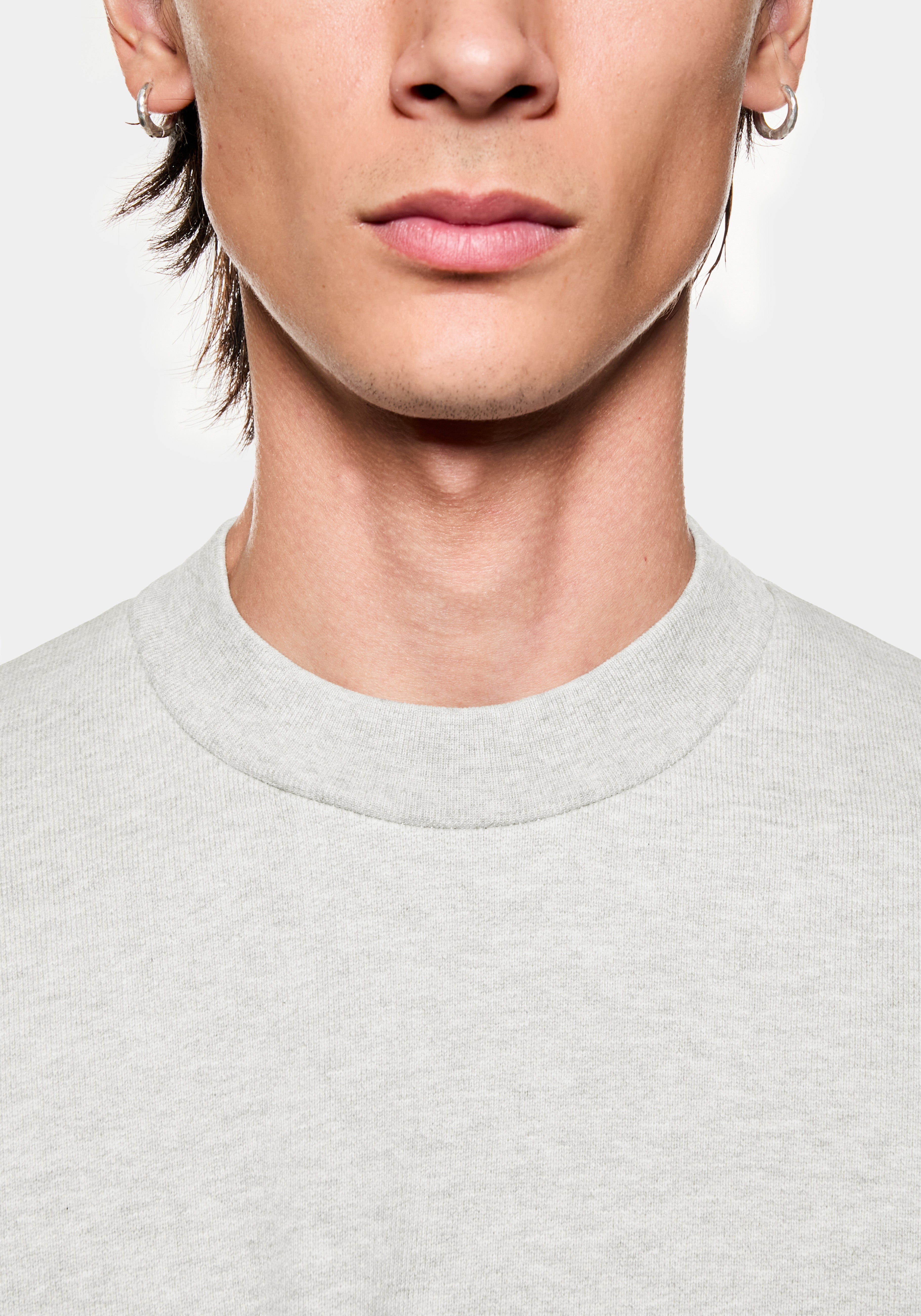 Close-up of the close-fitting ribbed crew neck on the oatmeal 800 GSM loopback
