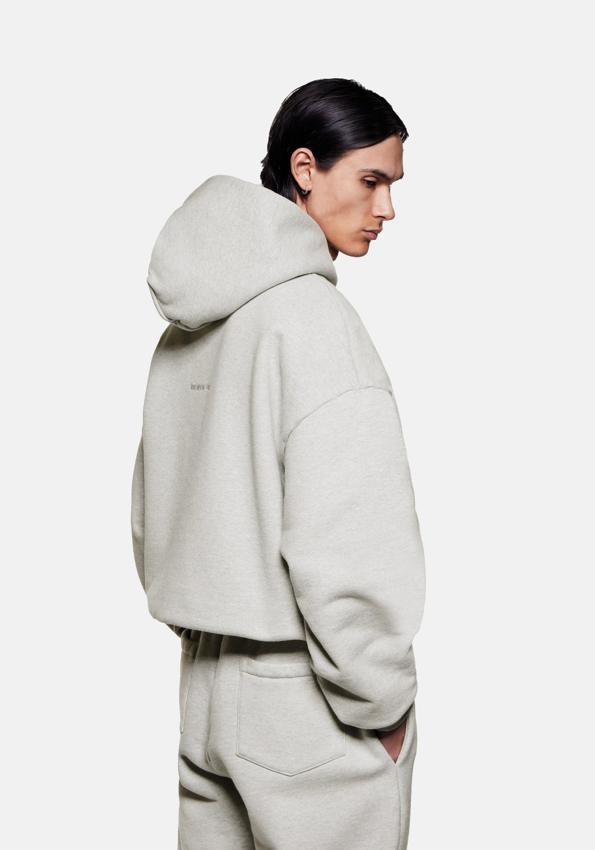 Rear side view of the Superweight Hoody in Oatmeal