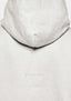 Close-up of the tonal logo embroidery on the Superweight Hoody in Oatmeal