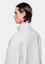 Side profile of the Grey Quarter Zip showing the funnel neck and tonal logo below the collar