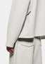 Close-up of the open cuff and hem on the Oatmeal Superweight Quarter Zip