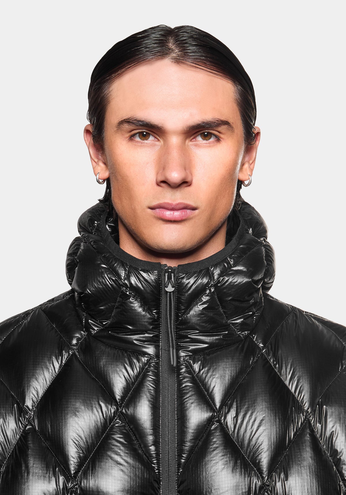 Close-up of the collar on the Diamond Down Jacket in Black, styled with the hood down