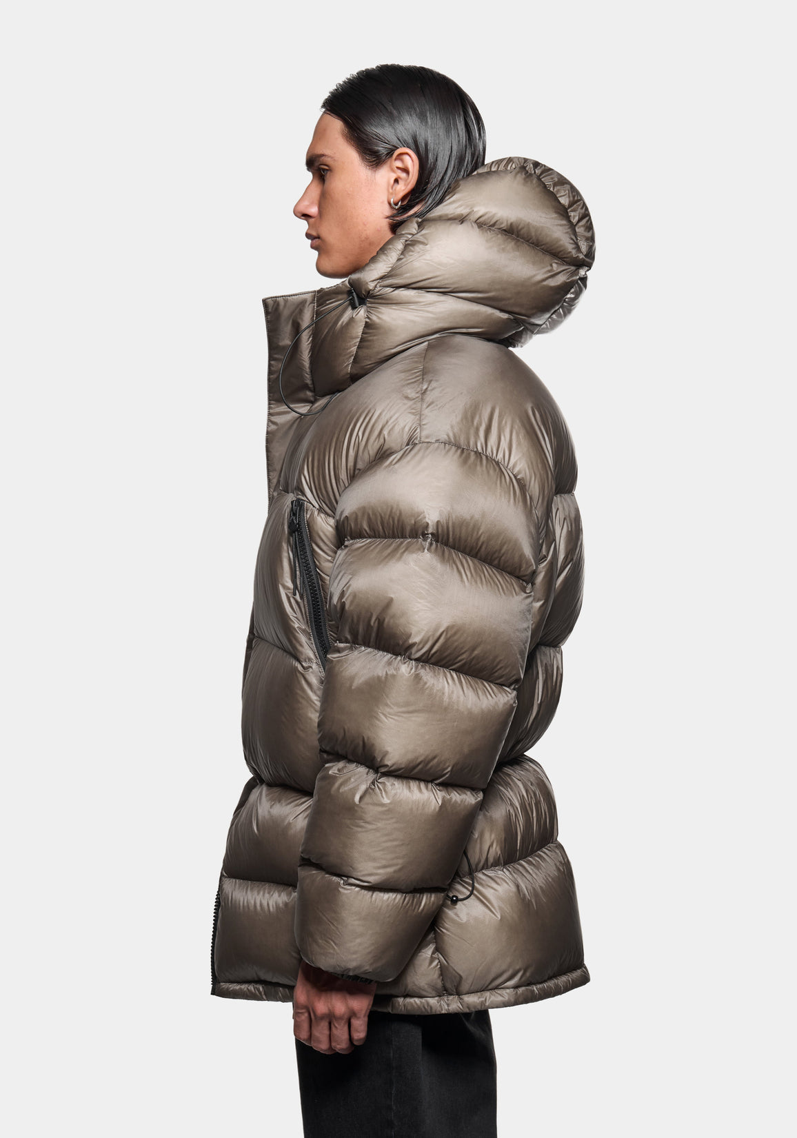 Close-up rear view of the hood up on the Apex Down Parka in Moss