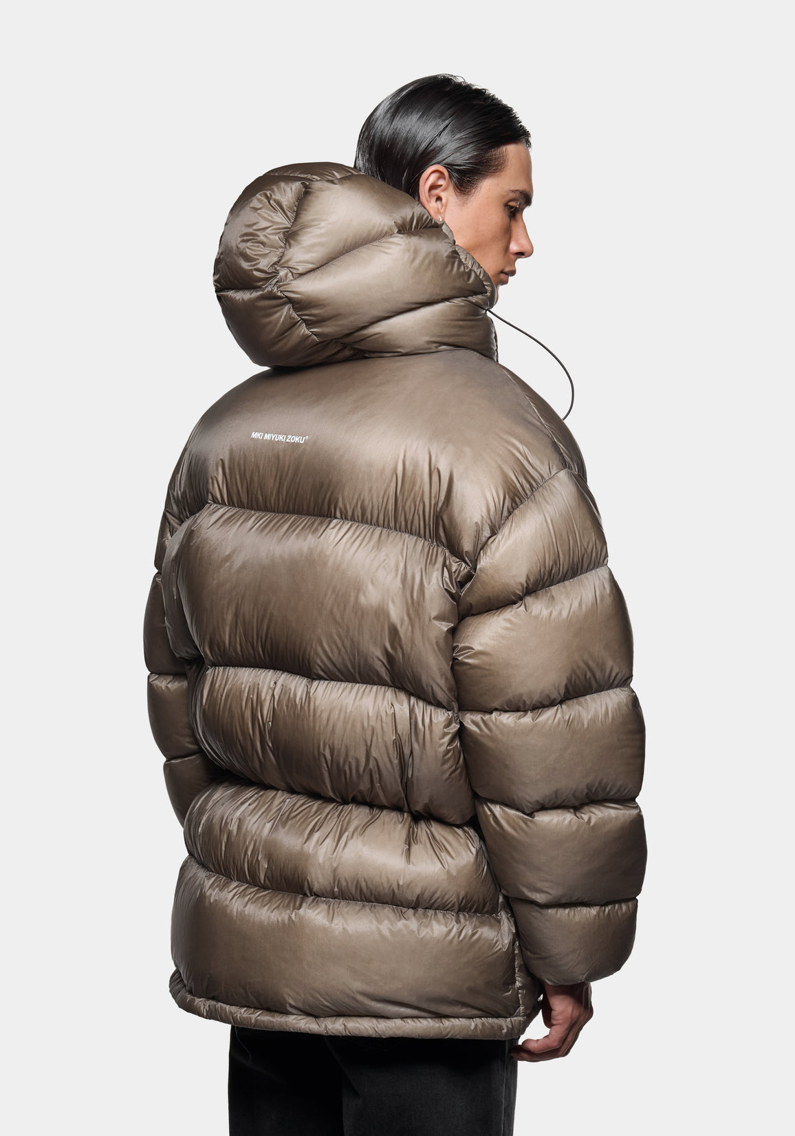 Close-up front view of the hood up on the Apex Down Parka in Moss