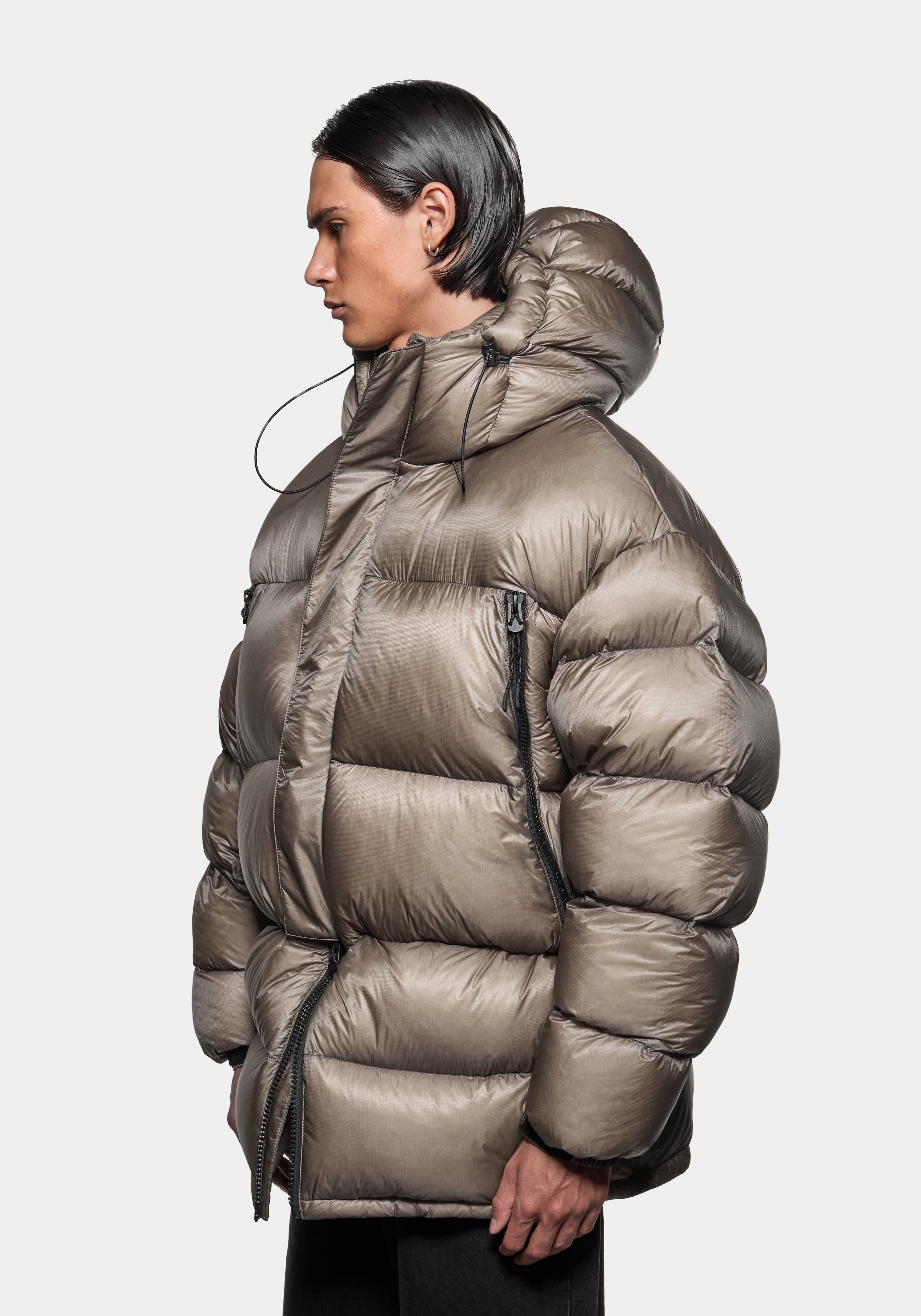 Close-up side view of the hood up on the Apex Down Parka in Moss