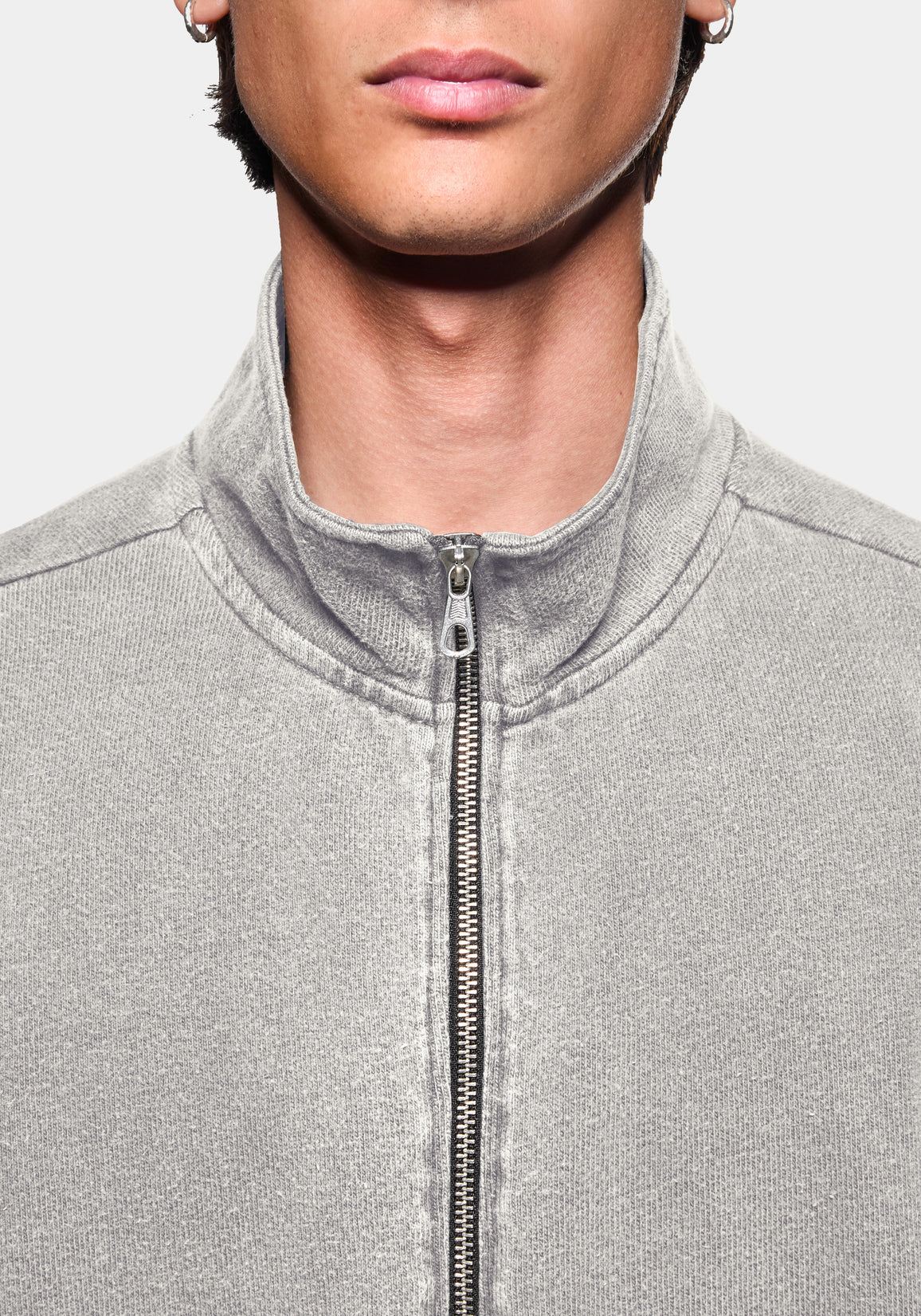 Close-up of the zip funnel neck on the track jacket