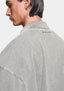 Side profile showing the small logo at the back of the collar
