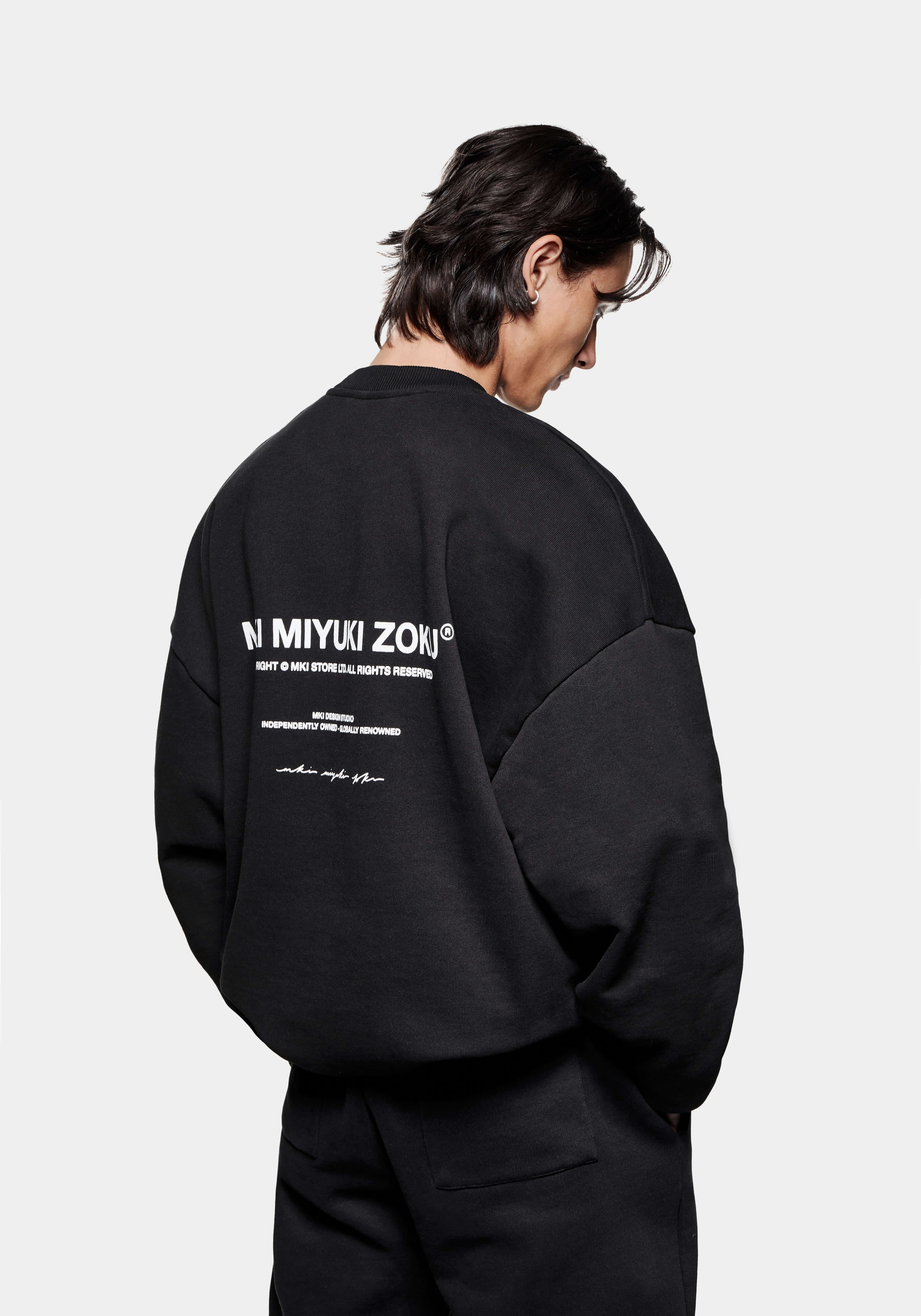Back side view of the Design Studio Crewneck in Black