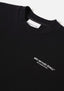 Flat close-up of the contrast Design Studio branding on the chest of the Design Studio Crewneck in Black