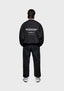 Full back view of the MKI MIYUKI ZOKU Design Studio Crewneck in Black, in an oversized box fit